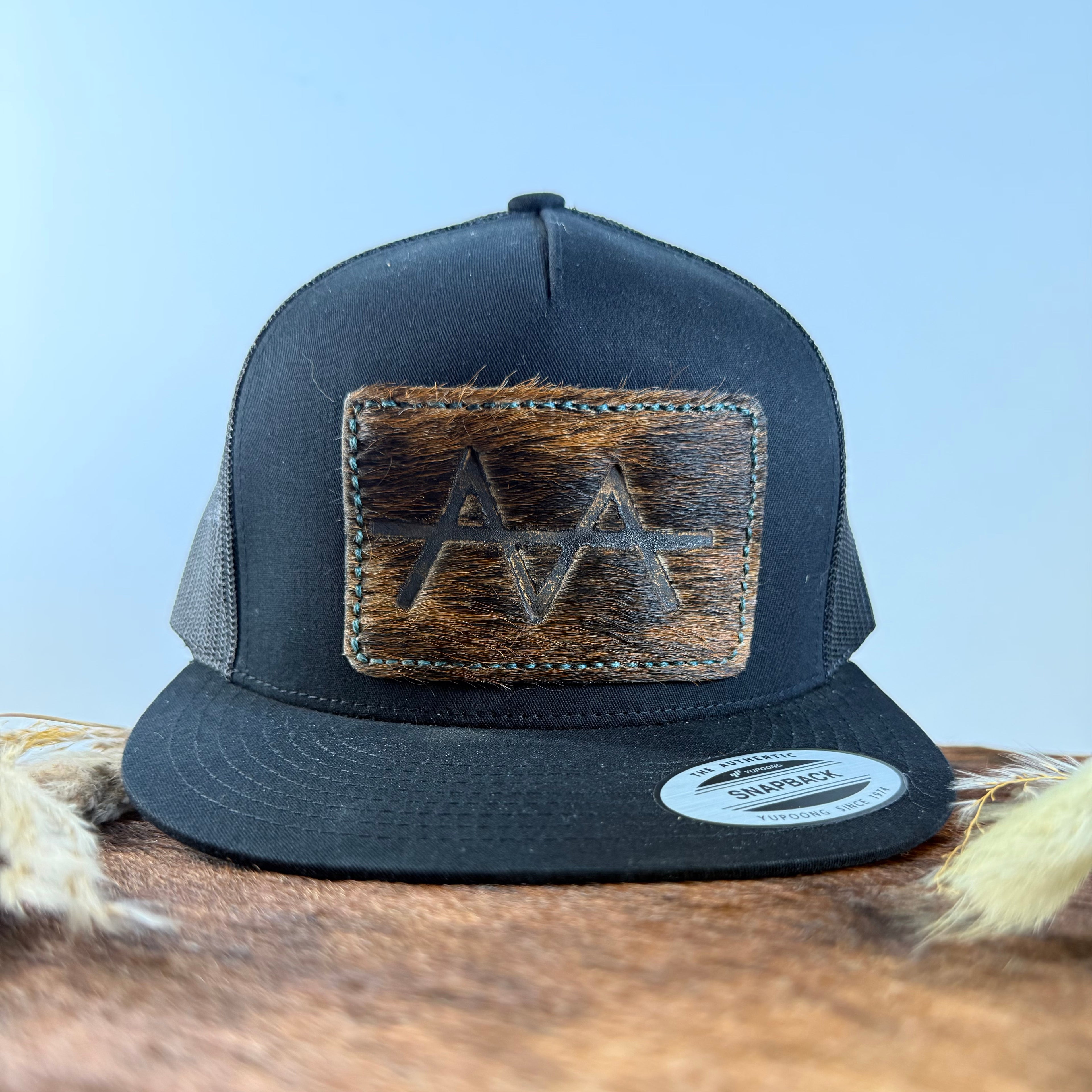 Teal Stitch Dark Brindle Cowhide Patch All-Black Snapback Hat
